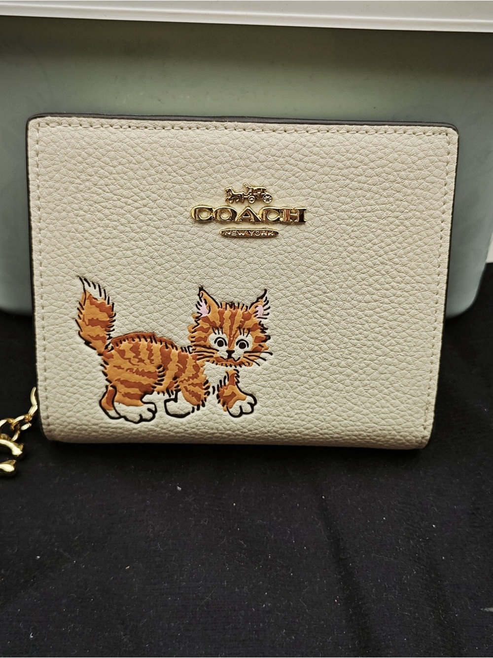 Coach Cream Pebbled Leather Wallet with Orange Cat Appliqué